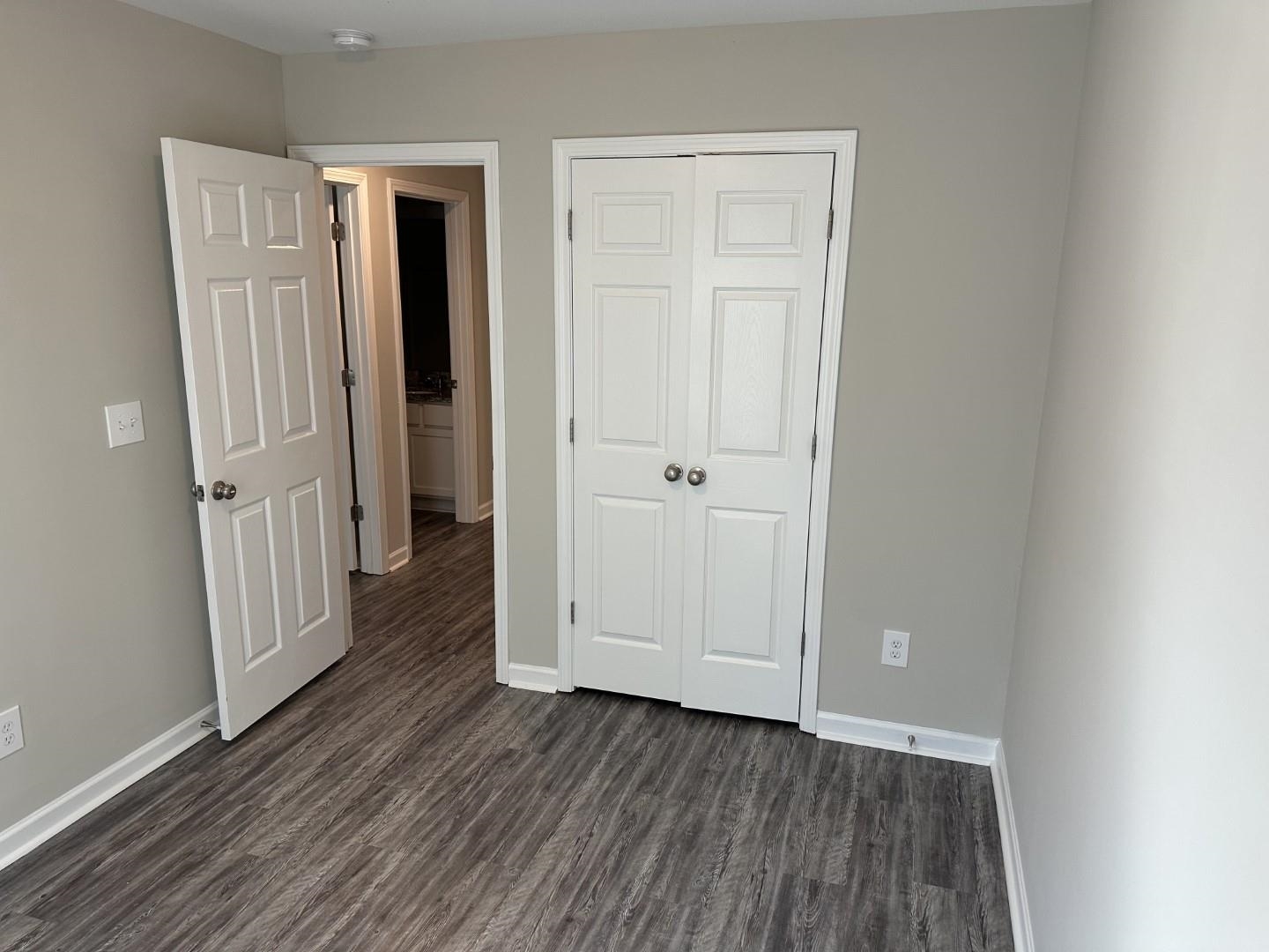 712 Keeshono St Union, Unit 712 Union City, GA 30291 - Photo 22 of 22 an empty room with wooden floor and entryway