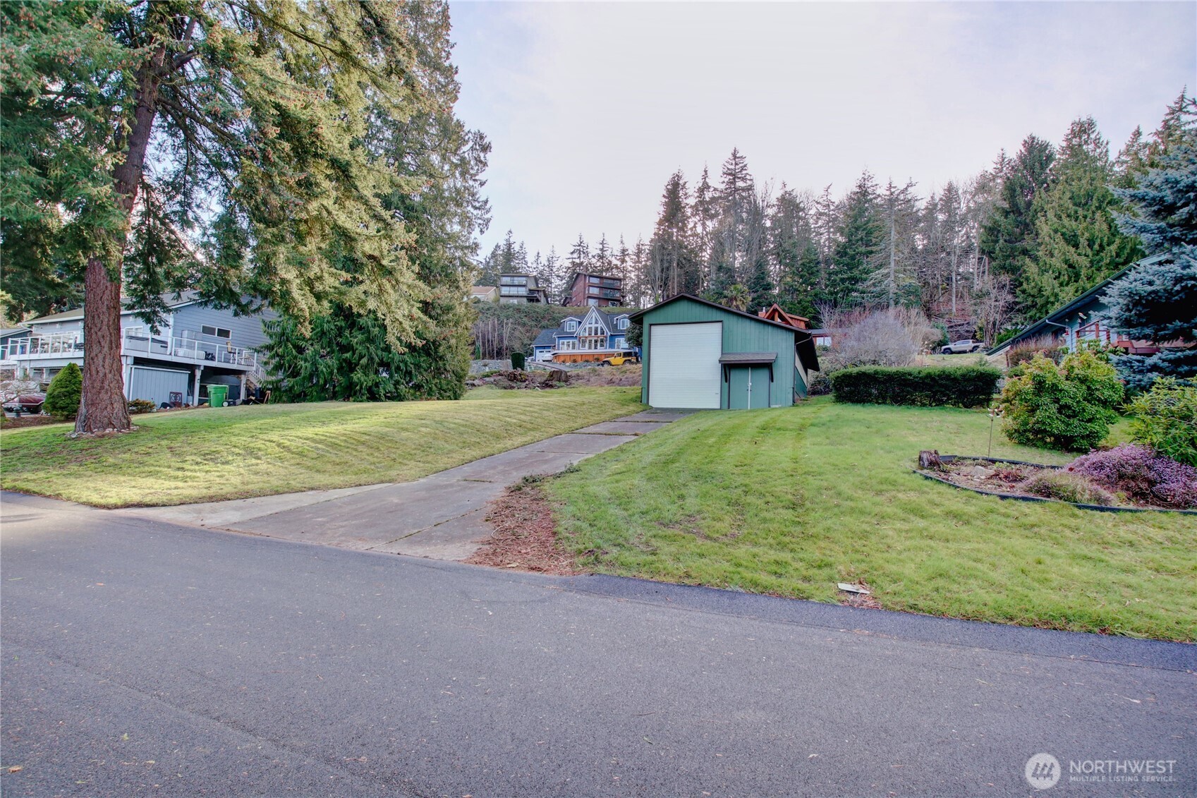 4116 Mitchell Drive Anacortes, WA 98221 - Photo 26 of 39 a view of a house with swimming pool and a yard