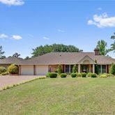 a front view of a house with yard