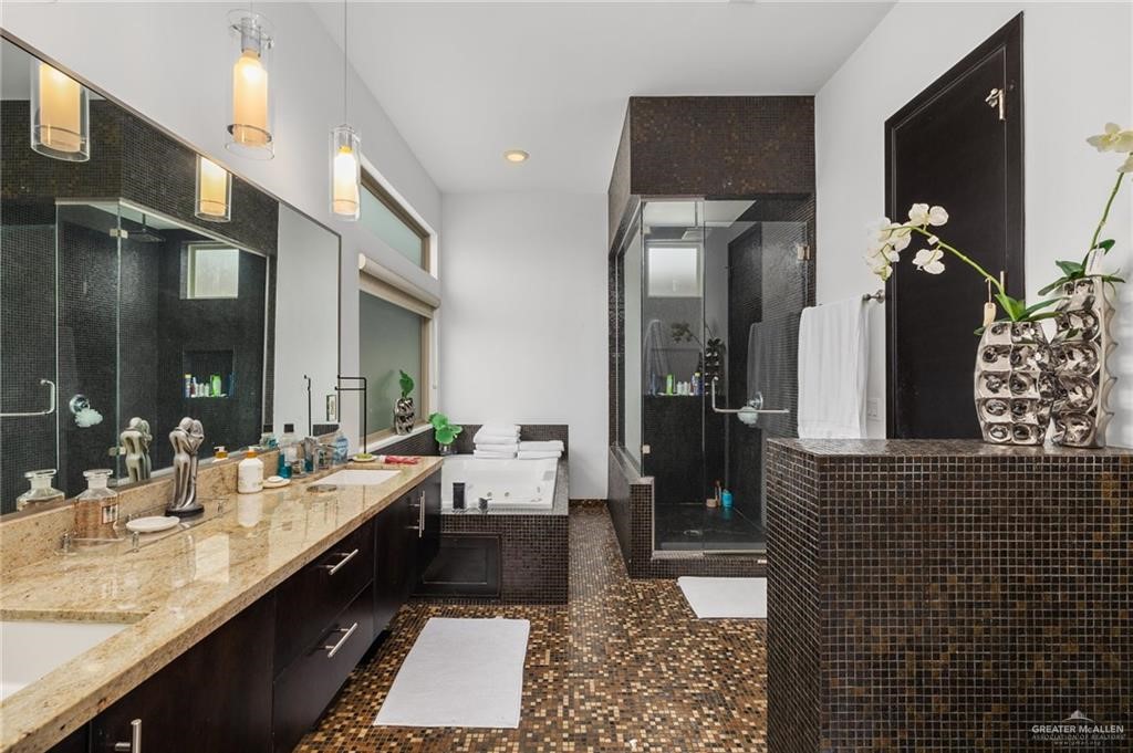 701 Sycamore Avenue Mission, TX 78572 - Photo 9 of 21 a bathroom with a double vanity sink and a mirror