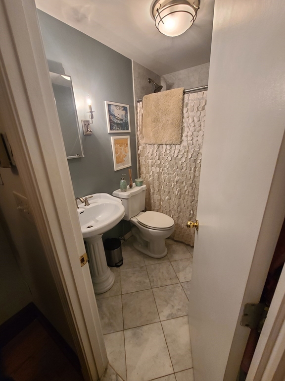 32 Fleet Street, Unit 5 Boston, MA 02113 - Photo 11 of 12 a bathroom with a sink and a toilet