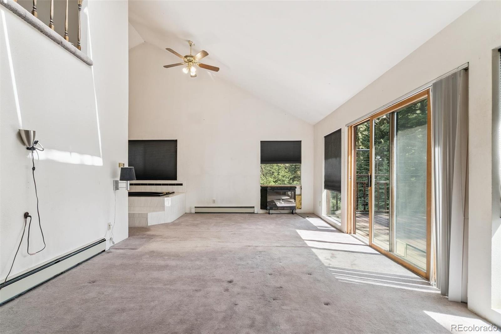 3909 County Road 72 Bailey, CO 80421 - Photo 13 of 50 a view of a livingroom with furniture and a flat screen tv