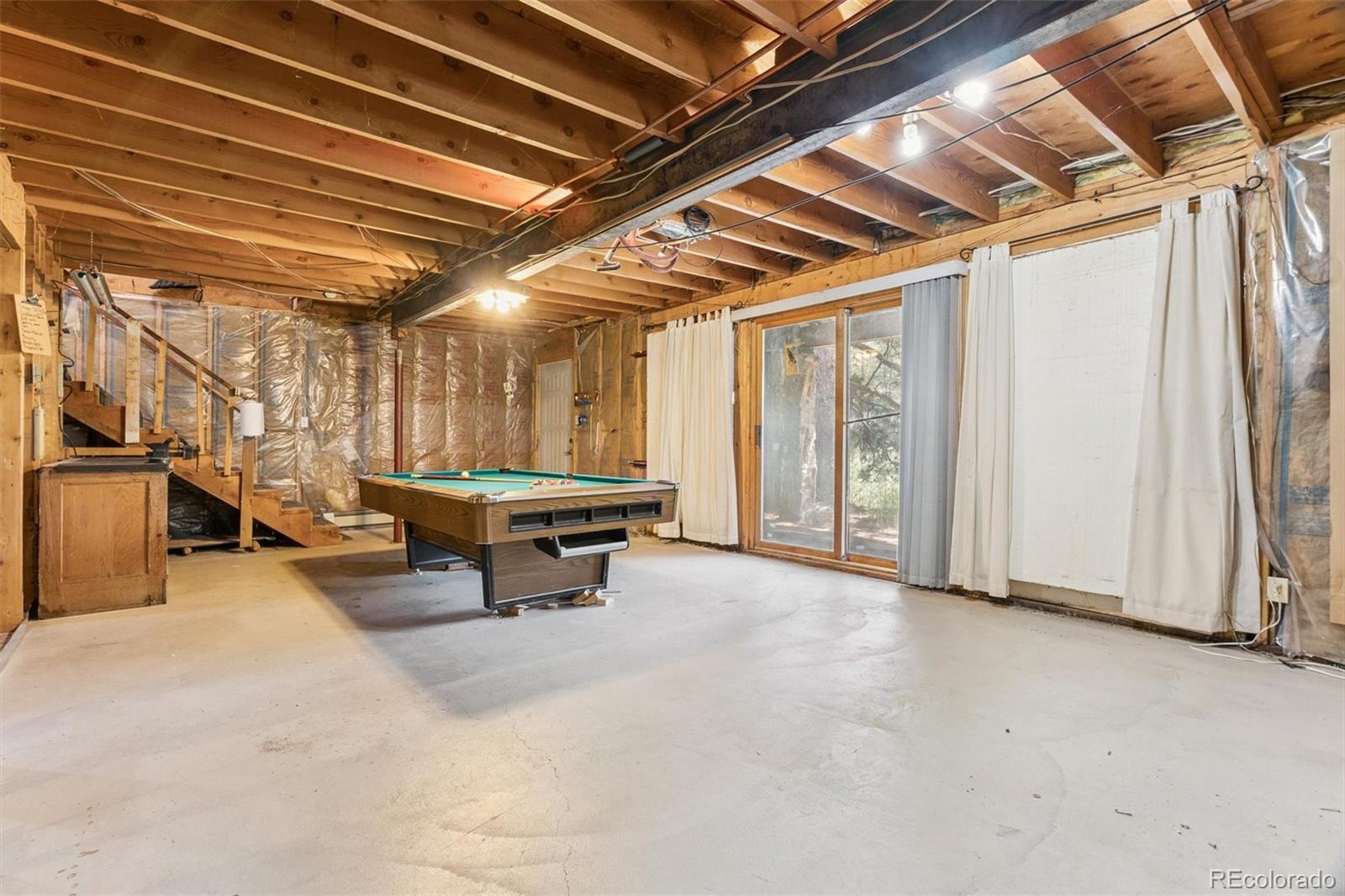 3909 County Road 72 Bailey, CO 80421 - Photo 17 of 50 a view of a room with table & chairs