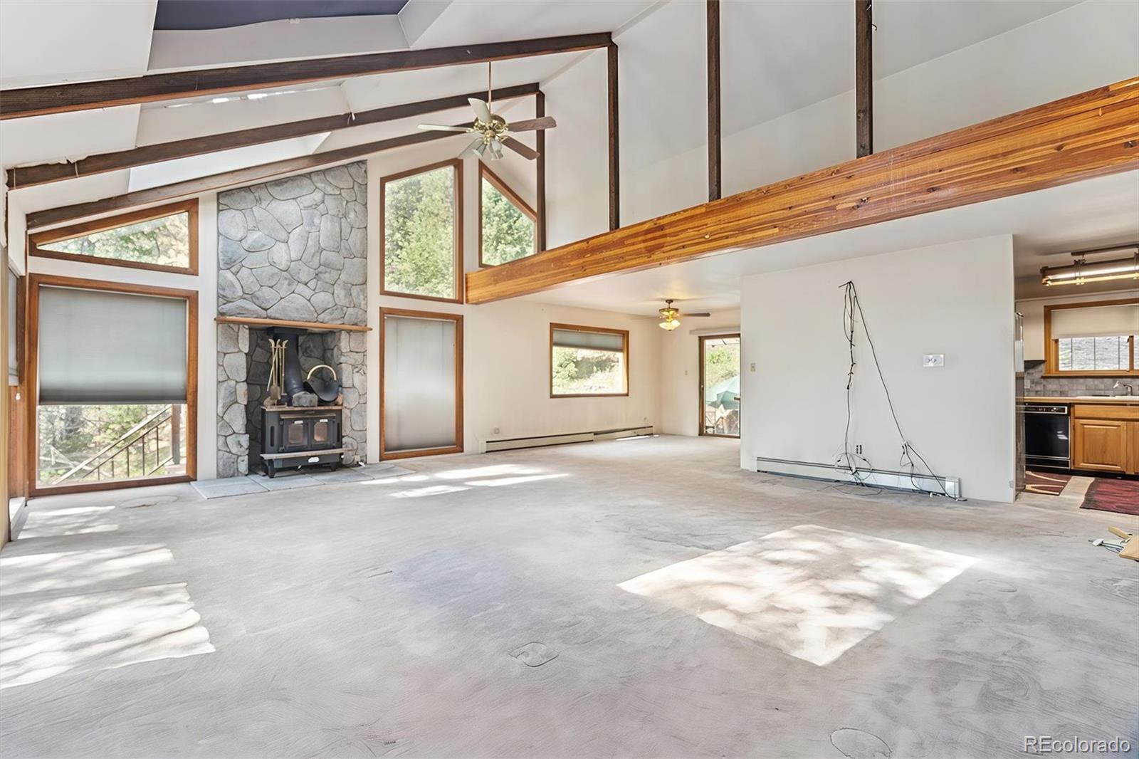 3909 County Road 72 Bailey, CO 80421 - Photo 2 of 50 a view of a house with a garage