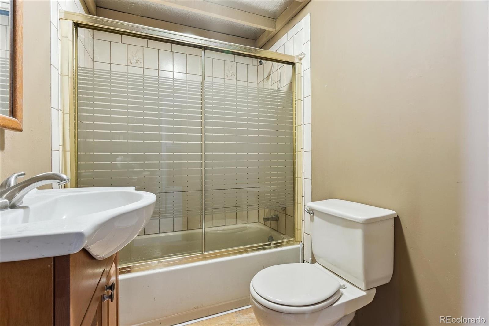 3909 County Road 72 Bailey, CO 80421 - Photo 21 of 50 a bathroom with a toilet a sink and shower