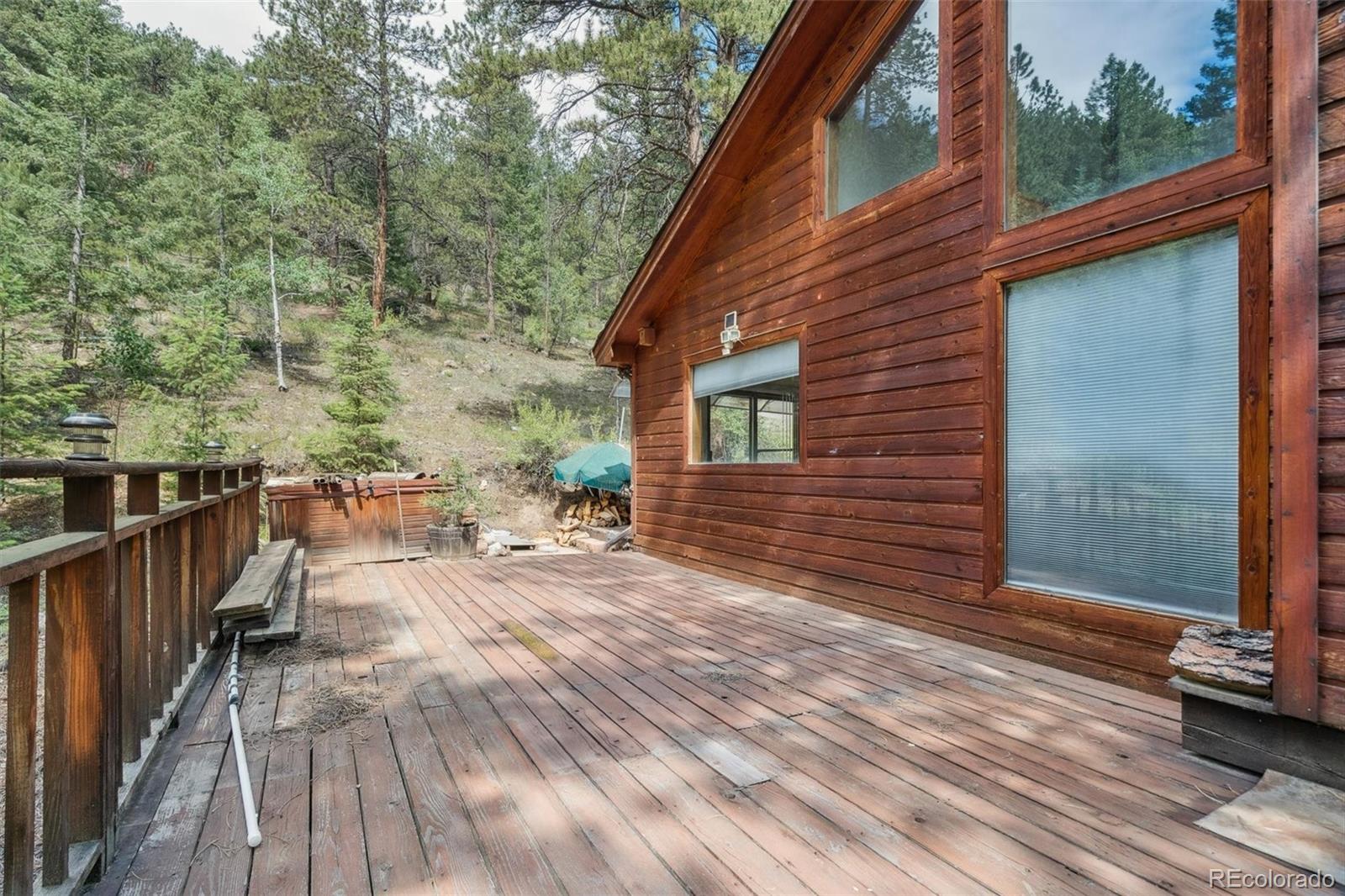 3909 County Road 72 Bailey, CO 80421 - Photo 25 of 50 a view of a backyard with sitting area