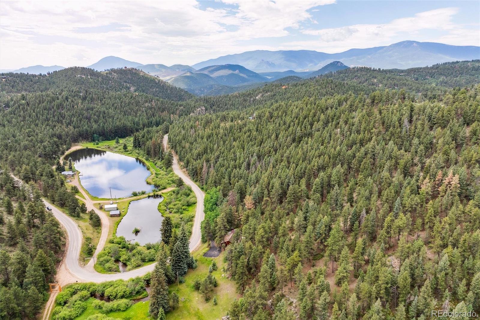 3909 County Road 72 Bailey, CO 80421 - Photo 37 of 50 a view of a lush green hillside and a mountain view