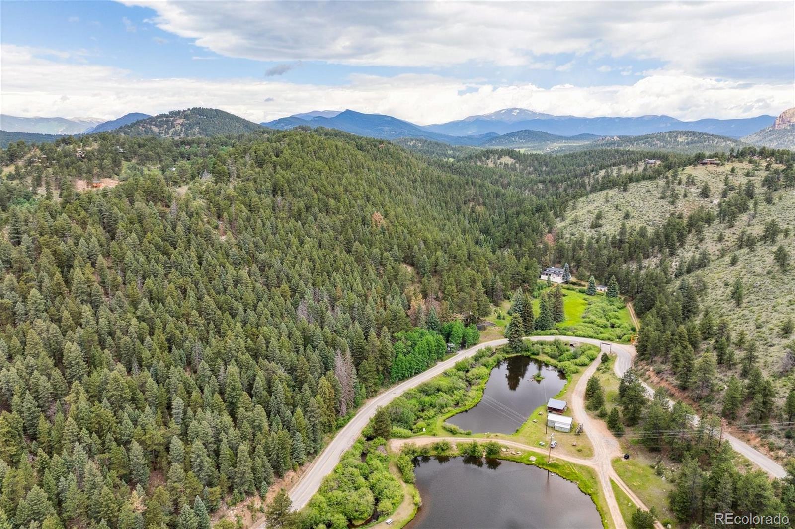 3909 County Road 72 Bailey, CO 80421 - Photo 39 of 50 a view of a city with lush green forest