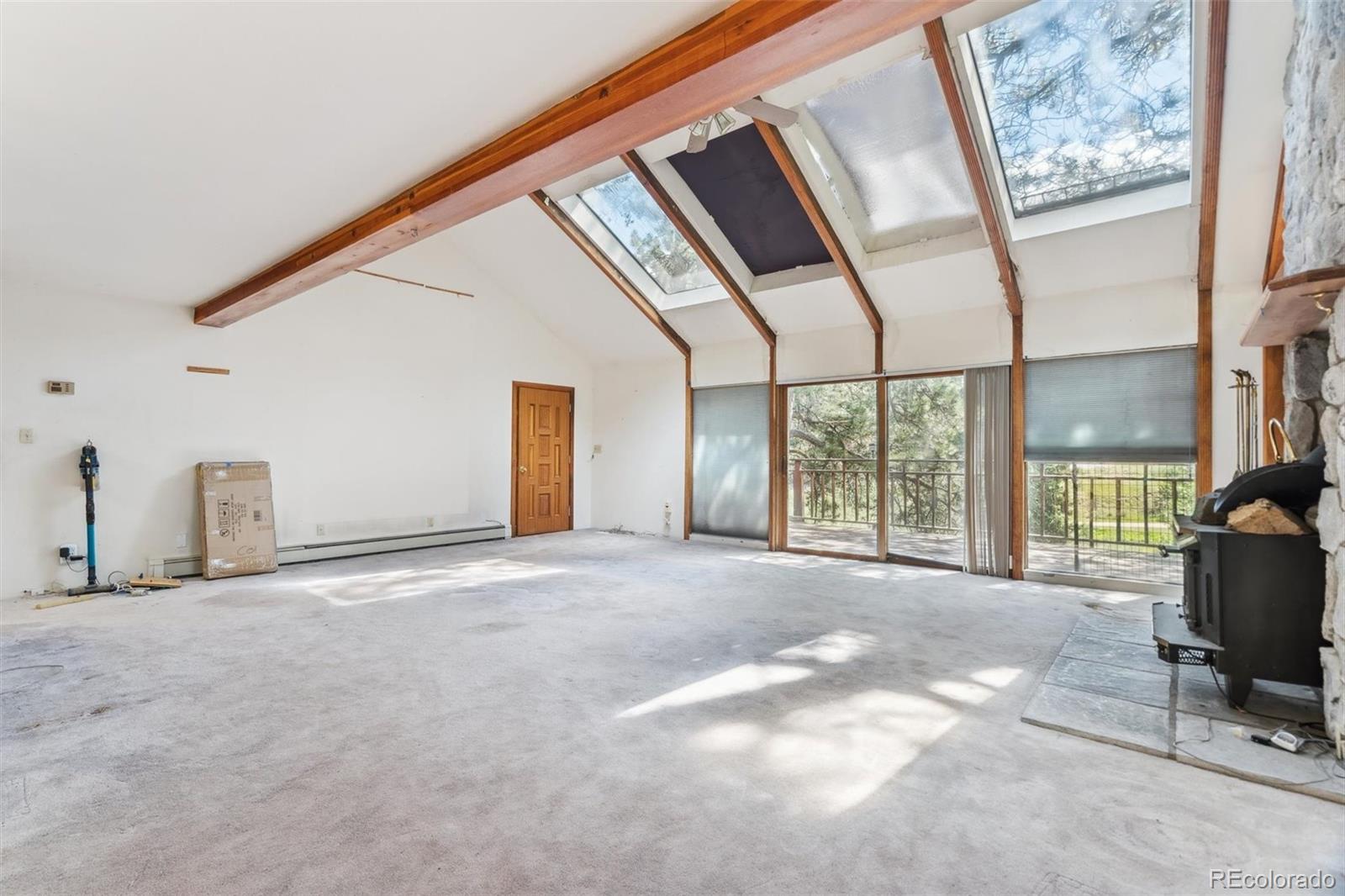 3909 County Road 72 Bailey, CO 80421 - Photo 4 of 50 a view of an empty room with a window