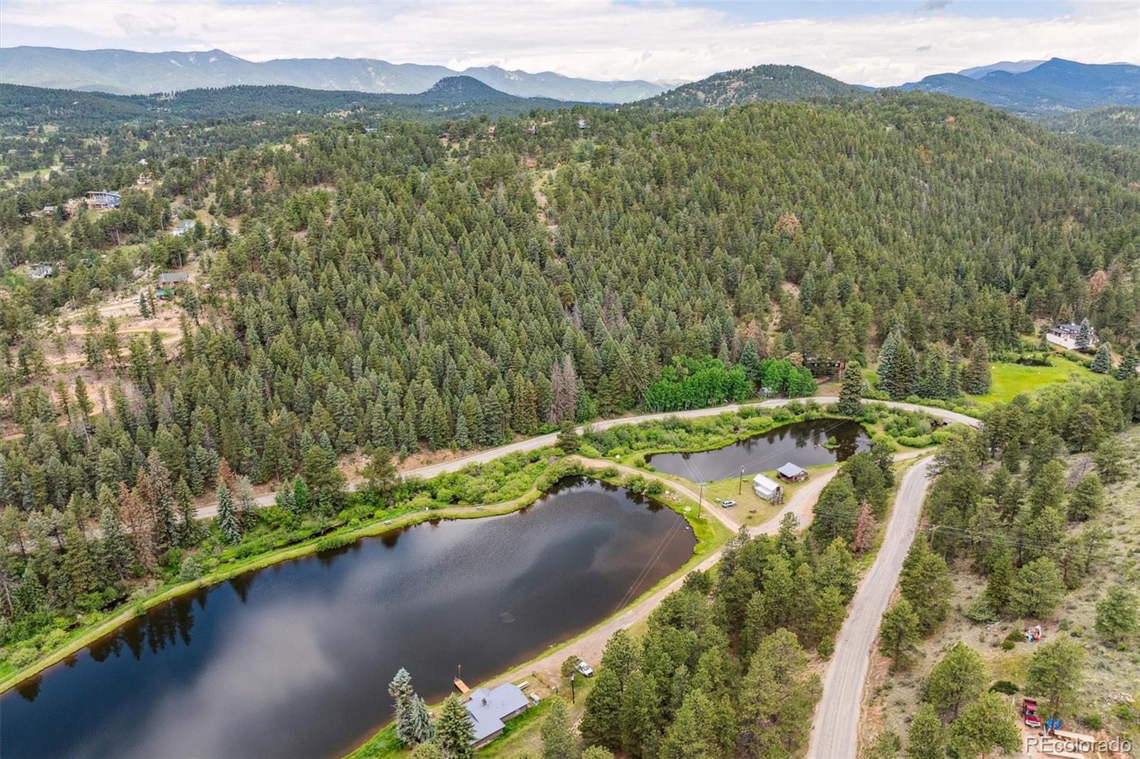 3909 County Road 72 Bailey, CO 80421 - Photo 41 of 50 a view of a lake with a mountain in the background