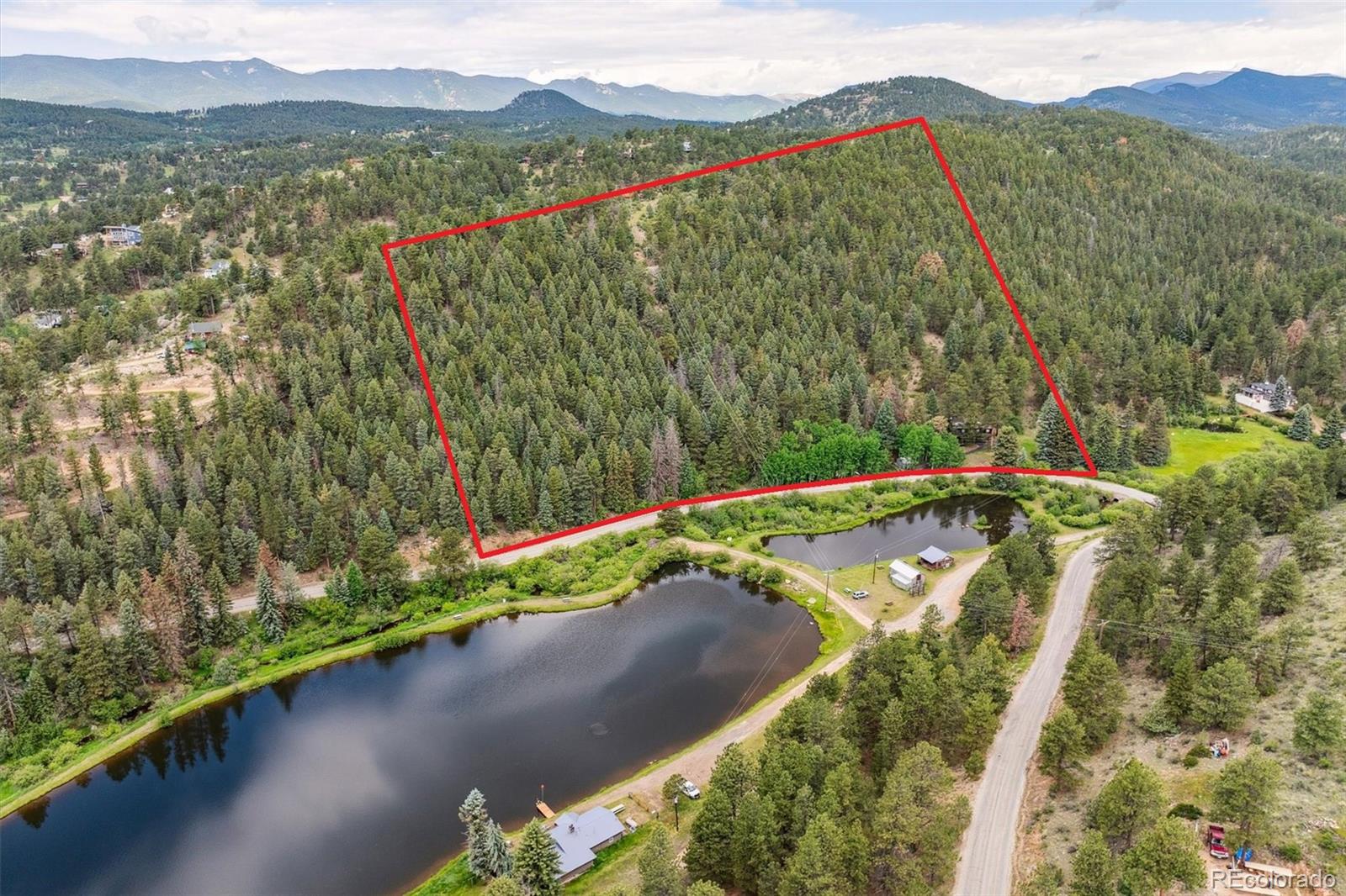 3909 County Road 72 Bailey, CO 80421 - Photo 42 of 50 a view of a lake with a mountain