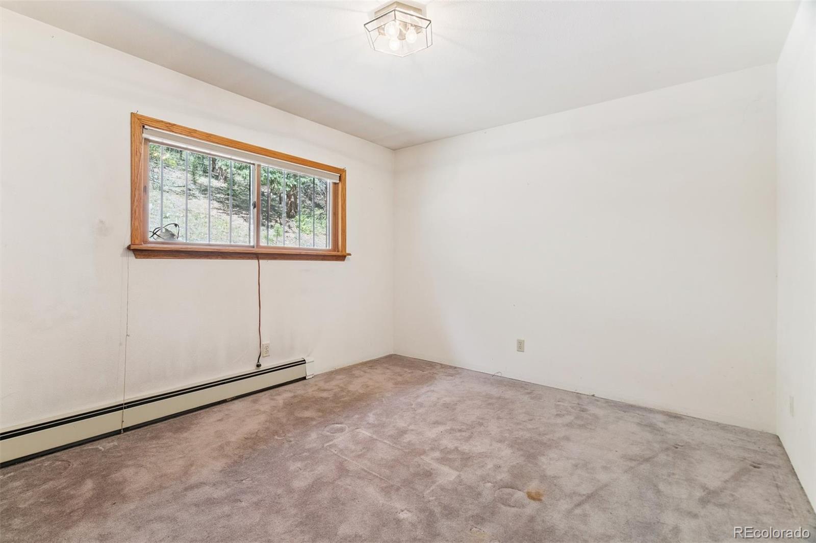 3909 County Road 72 Bailey, CO 80421 - Photo 9 of 50 an empty room with windows