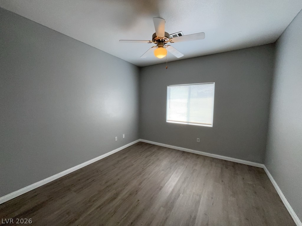 4915 East Russell Road, Unit 115 Las Vegas, NV 89120 - Photo 5 of 7 This spacious room features ample natural light and durable flooring, perfect for versatile living.