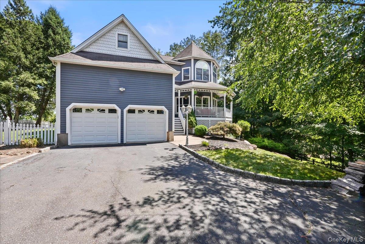 613 Rte 9W Piermont, NY 10968 - Photo 1 of 38 a front view of a house with a yard and garage