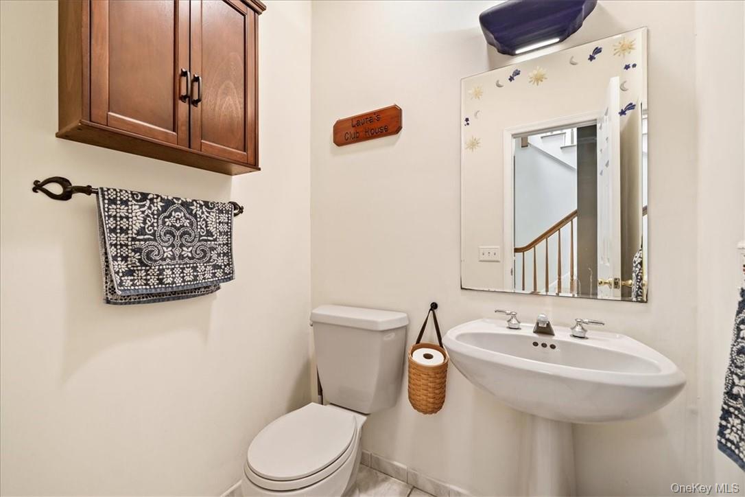 613 Rte 9W Piermont, NY 10968 - Photo 14 of 37 a bathroom with a sink a mirror and toilet