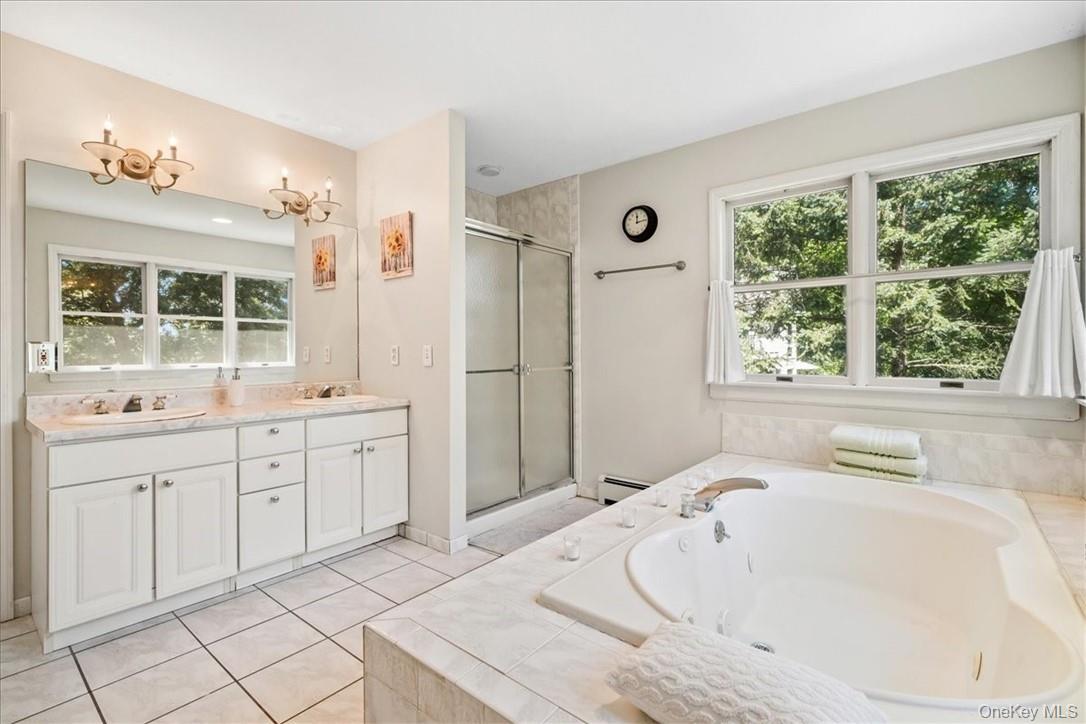 613 Rte 9W Piermont, NY 10968 - Photo 20 of 37 a spacious bathroom with a tub sink and mirror