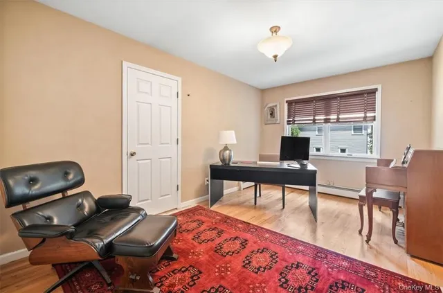 a workspace with furniture and a window