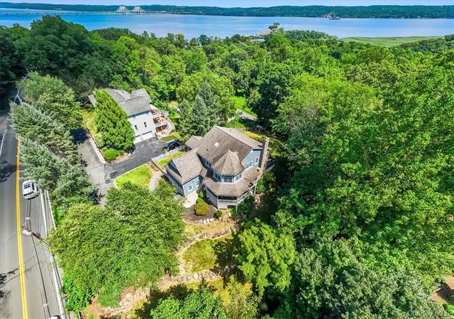 a view of a backyard with plants and a garden