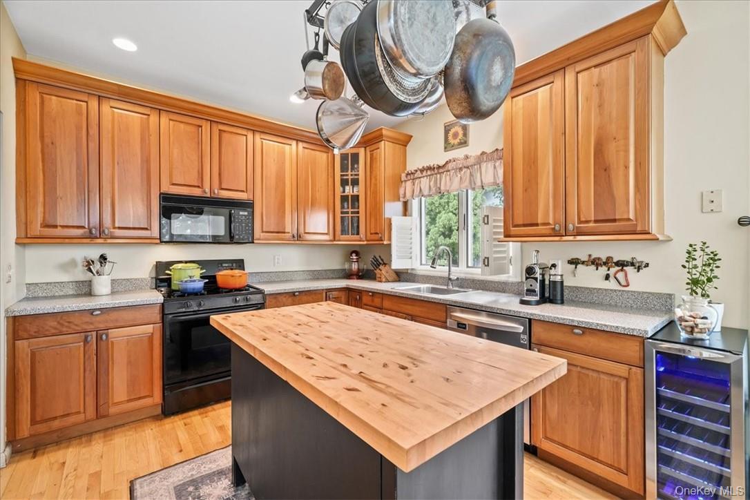 613 Rte 9W Piermont, NY 10968 - Photo 10 of 37 a kitchen with stainless steel appliances granite countertop a sink a stove cabinets counter space and a window