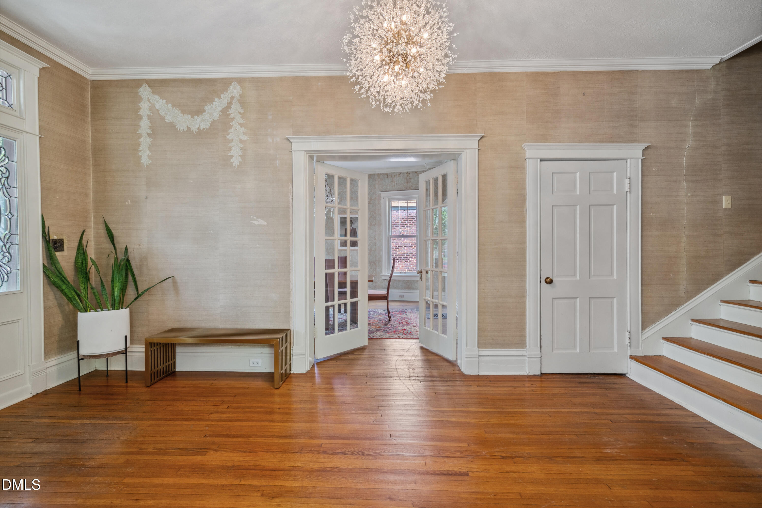 116 Hawthorne Road Raleigh, NC 27605 - Photo 14 of 61 a view of a hallway with wooden floor and staircase