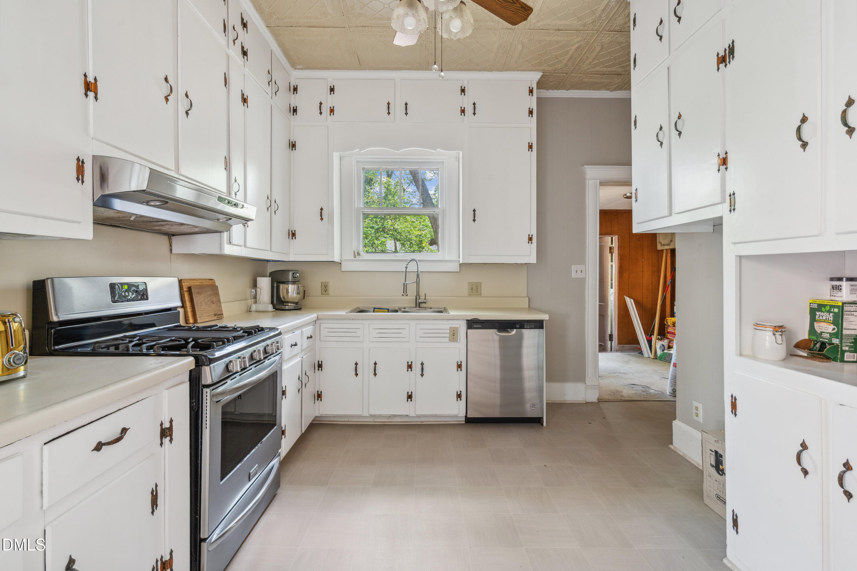 116 Hawthorne Road Raleigh, NC 27605 - Photo 19 of 61 a kitchen with stainless steel appliances white cabinets and a stove