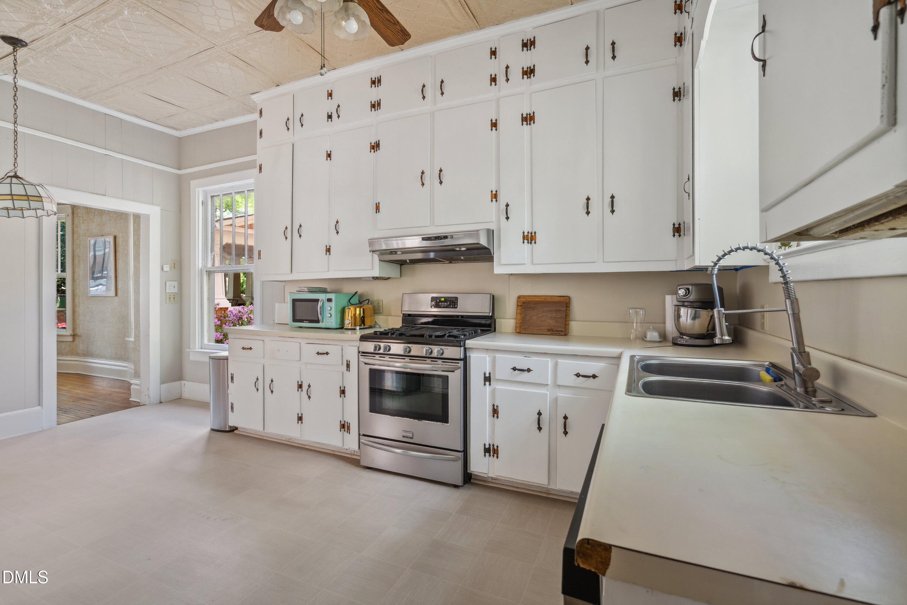 116 Hawthorne Road Raleigh, NC 27605 - Photo 20 of 61 a kitchen with granite countertop white cabinets and white appliances