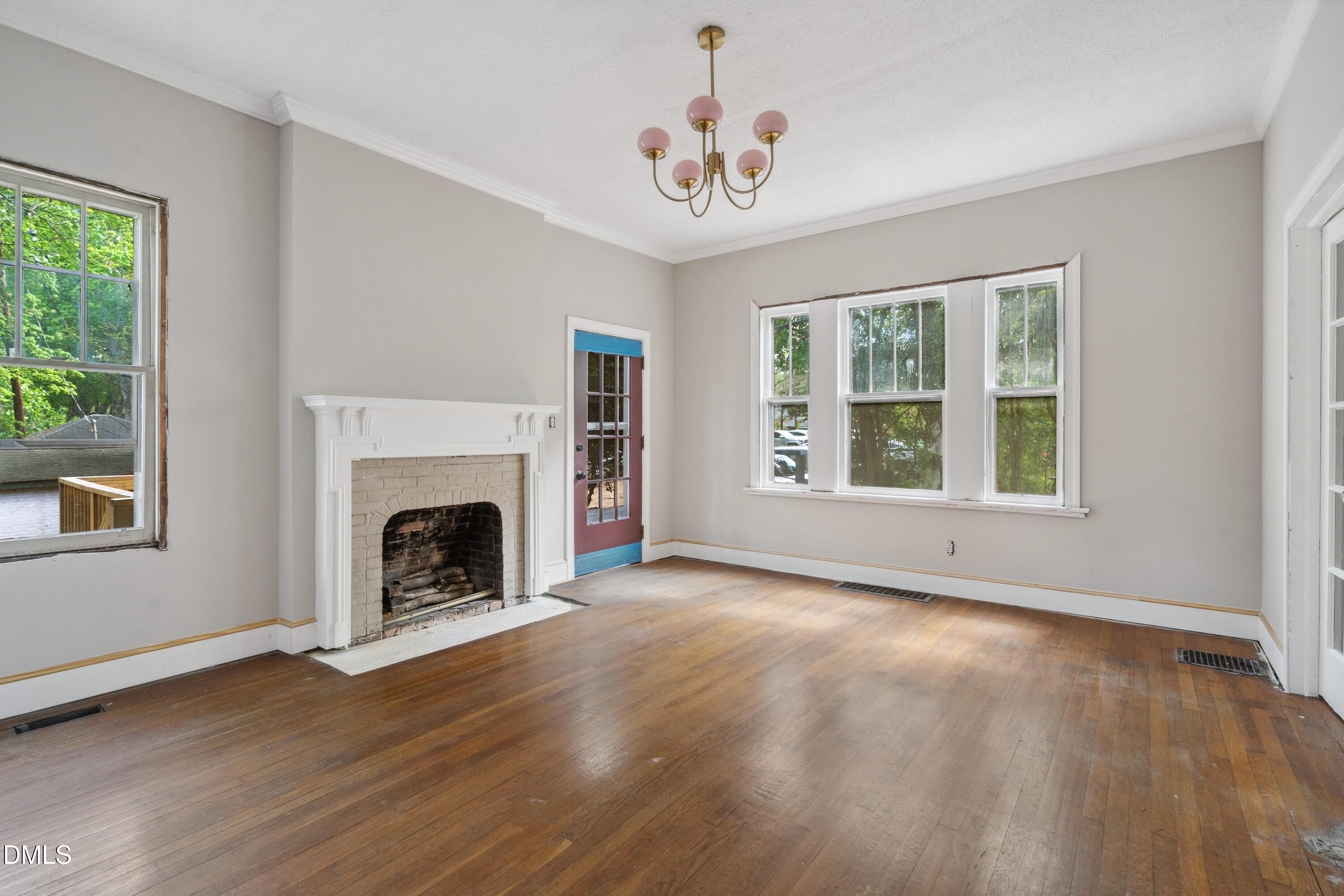 116 Hawthorne Road Raleigh, NC 27605 - Photo 22 of 61 a view of an empty room with wooden floor and a window