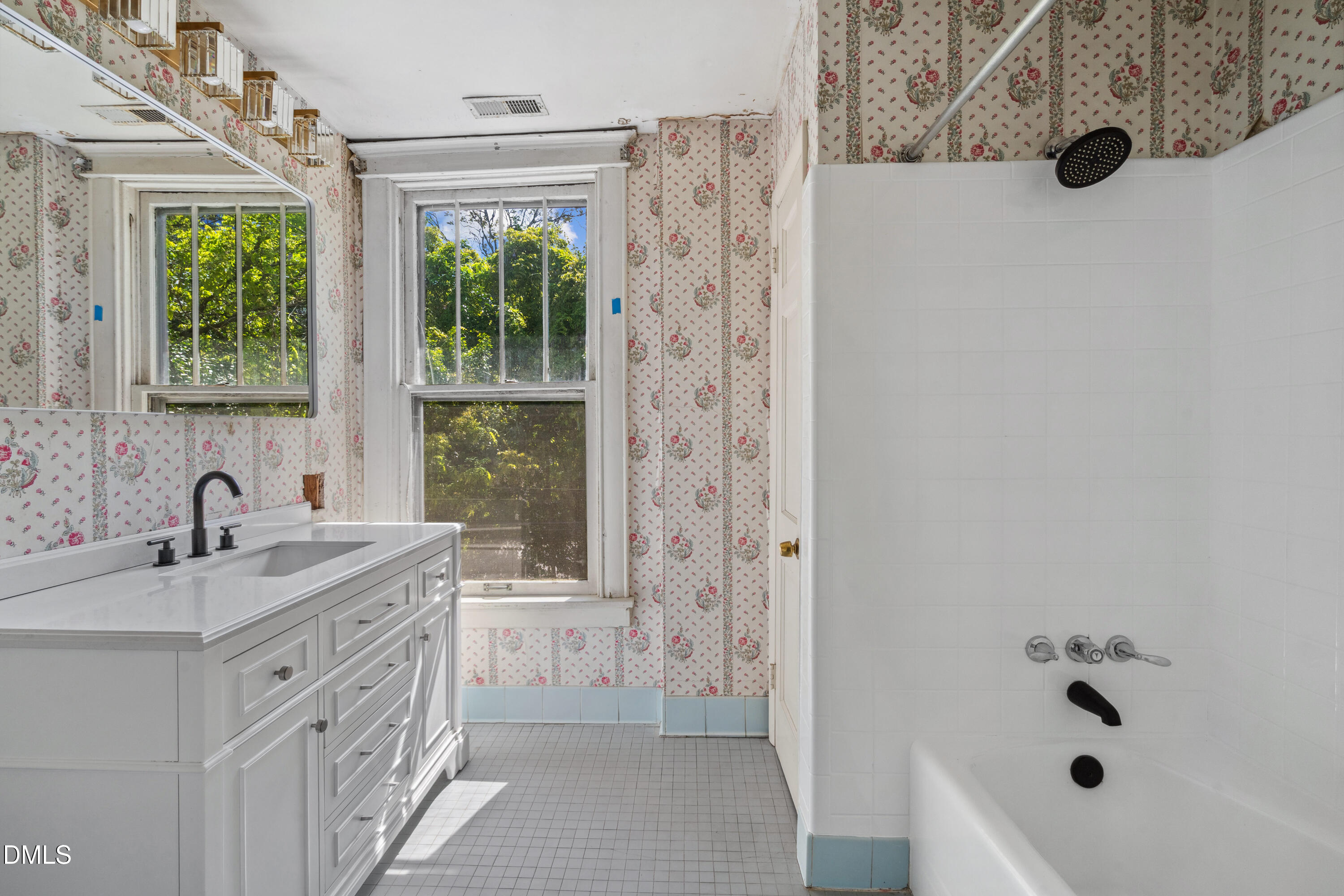 116 Hawthorne Road Raleigh, NC 27605 - Photo 29 of 61 a bathroom with a sink a toilet a window and shower