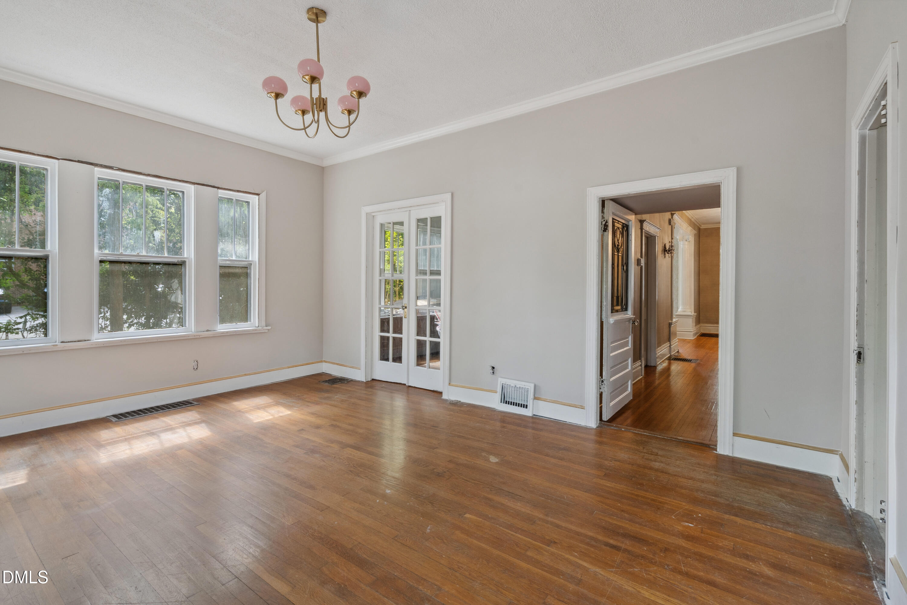 116 Hawthorne Road Raleigh, NC 27605 - Photo 31 of 61 a view of an empty room with wooden floor and a window