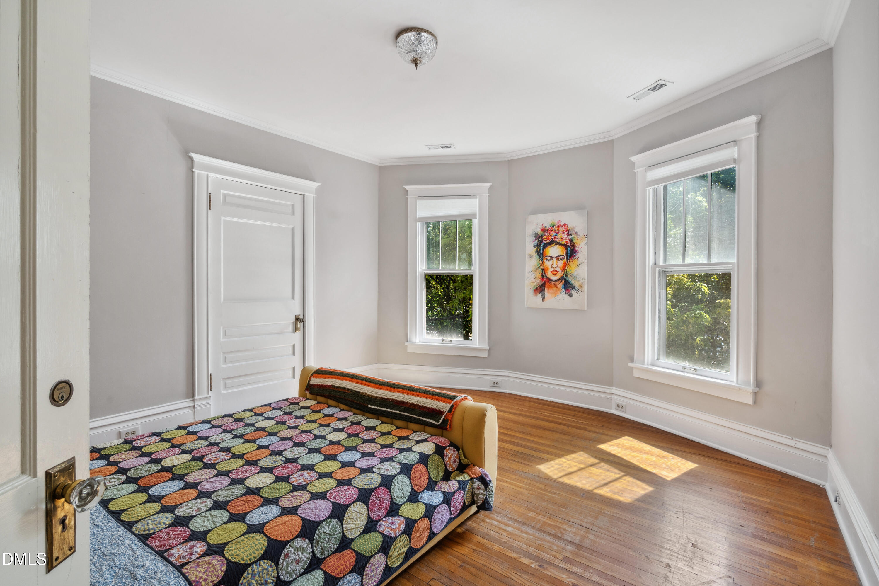 116 Hawthorne Road Raleigh, NC 27605 - Photo 39 of 61 a bedroom with natural light and a bed