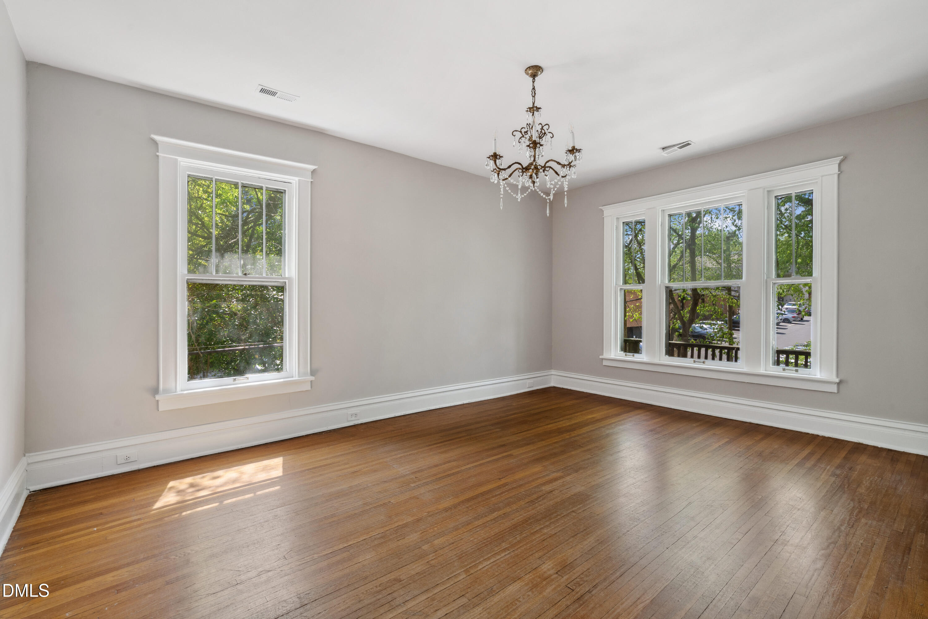 116 Hawthorne Road Raleigh, NC 27605 - Photo 43 of 61 a view of an empty room with wooden floor and a window