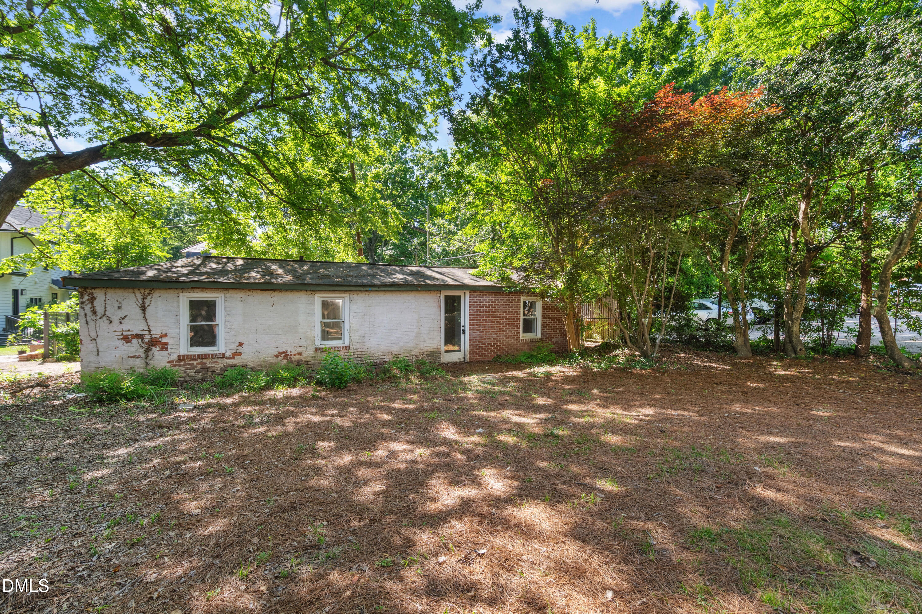 116 Hawthorne Road Raleigh, NC 27605 - Photo 54 of 61 a view of a backyard with a large tree
