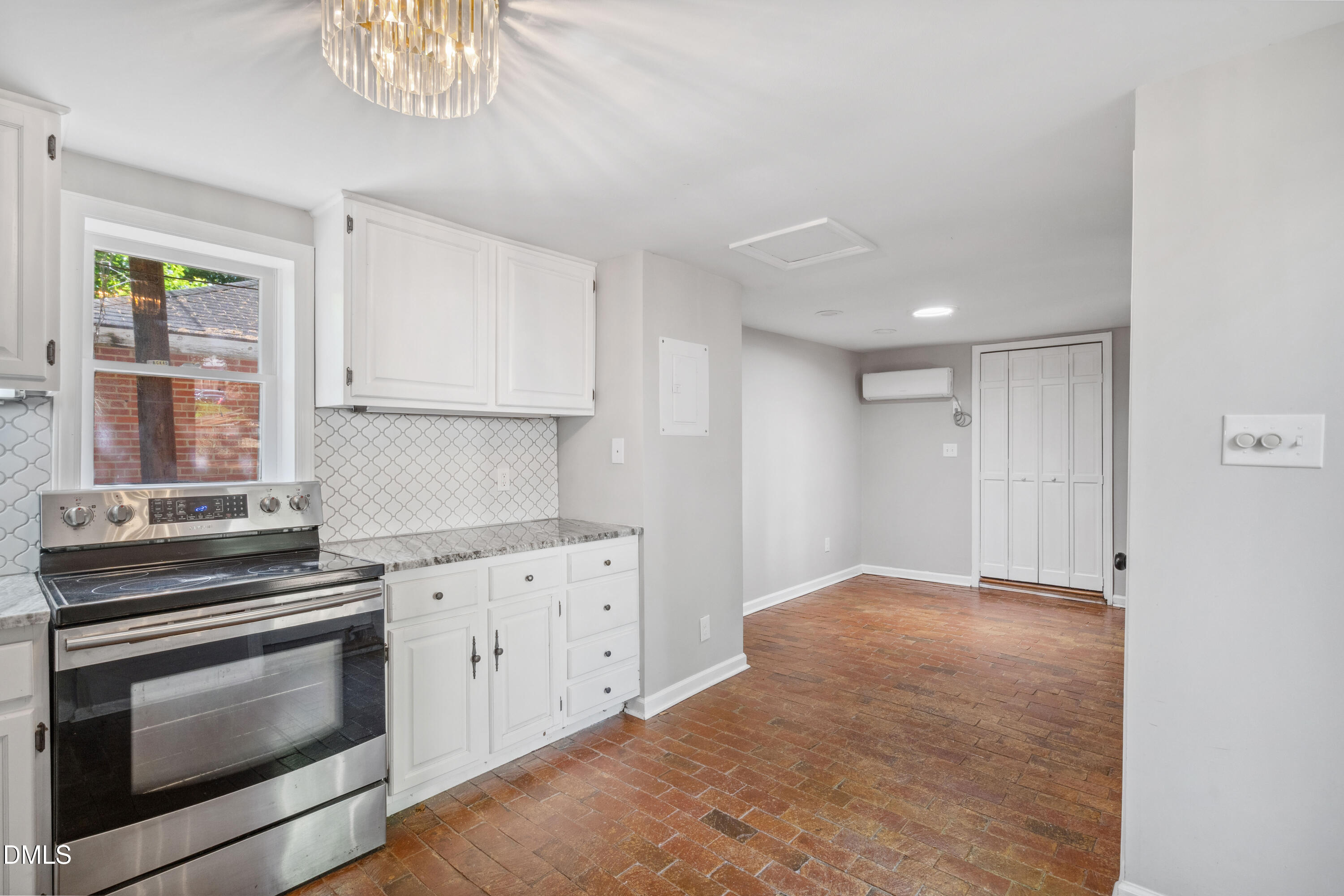 116 Hawthorne Road Raleigh, NC 27605 - Photo 56 of 61 a kitchen with granite countertop a stove a sink and a microwave