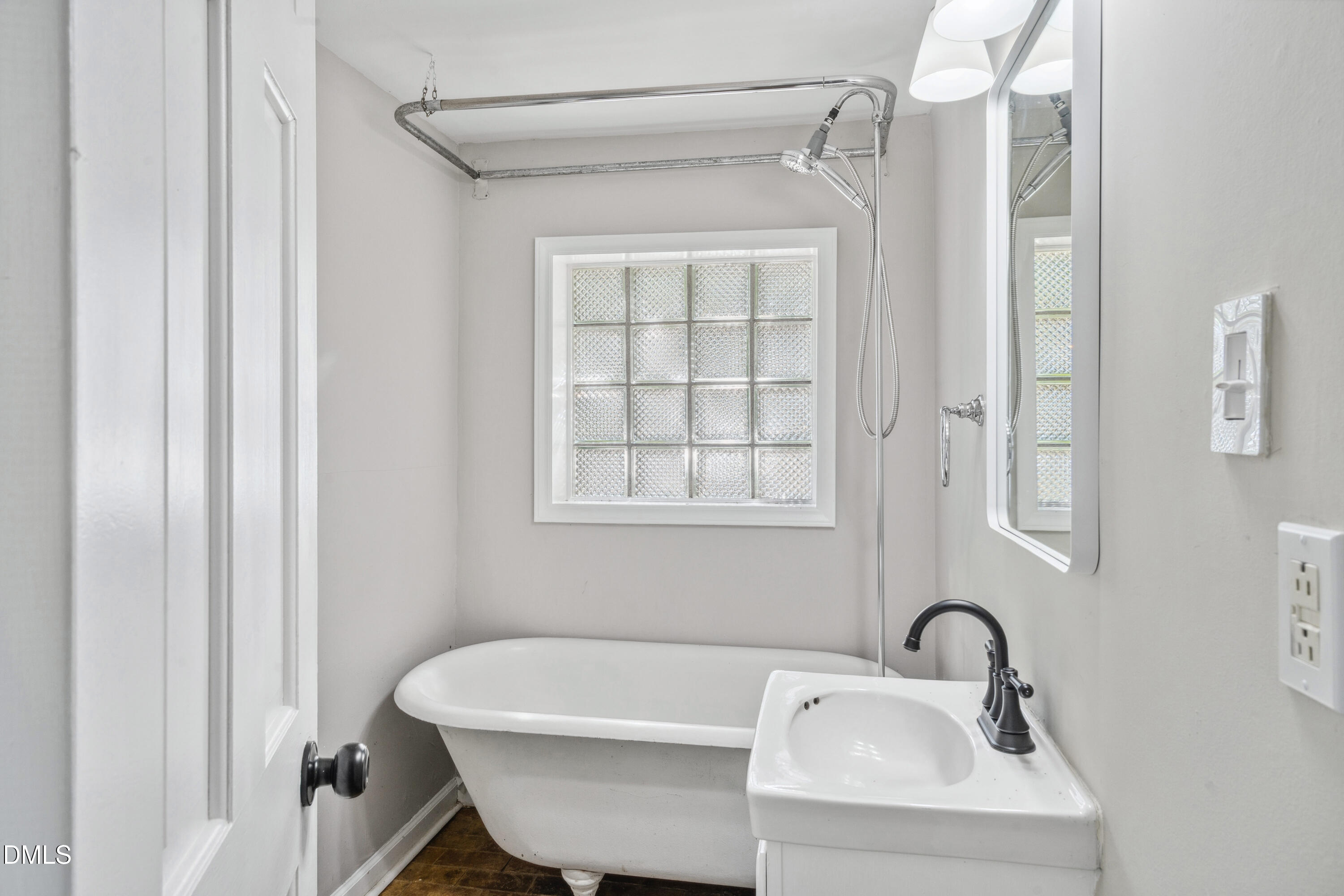 116 Hawthorne Road Raleigh, NC 27605 - Photo 61 of 61 a bathroom with a sink and a bathtub