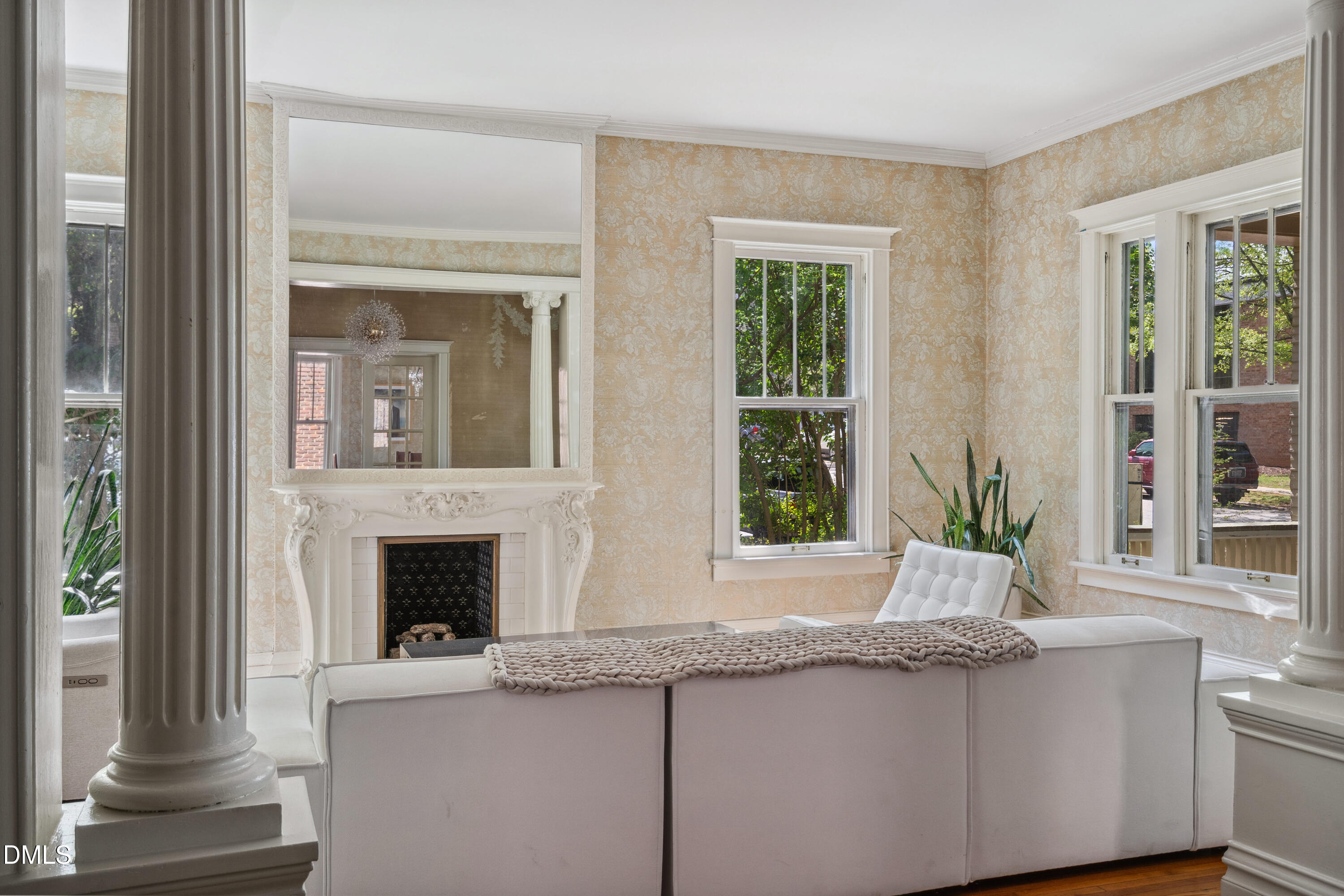 116 Hawthorne Road Raleigh, NC 27605 - Photo 9 of 61 a living room with a fireplace and windows