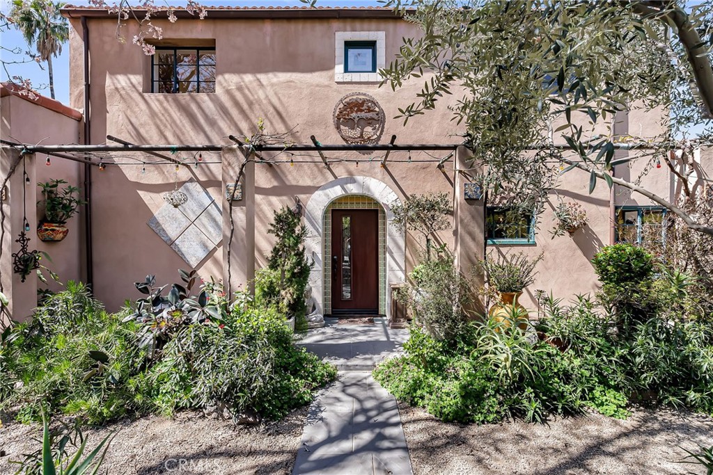 4688 Ladera Lane Riverside, CA 92501 - Photo 1 of 1 a front view of a house with garden