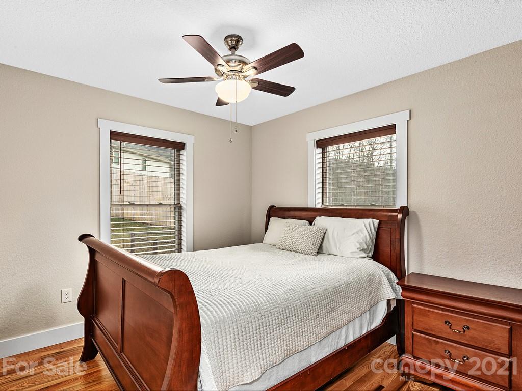 85 Dry Ridge Canton, NC 28716 - Photo 11 of 18 a bedroom with a large bed and a window