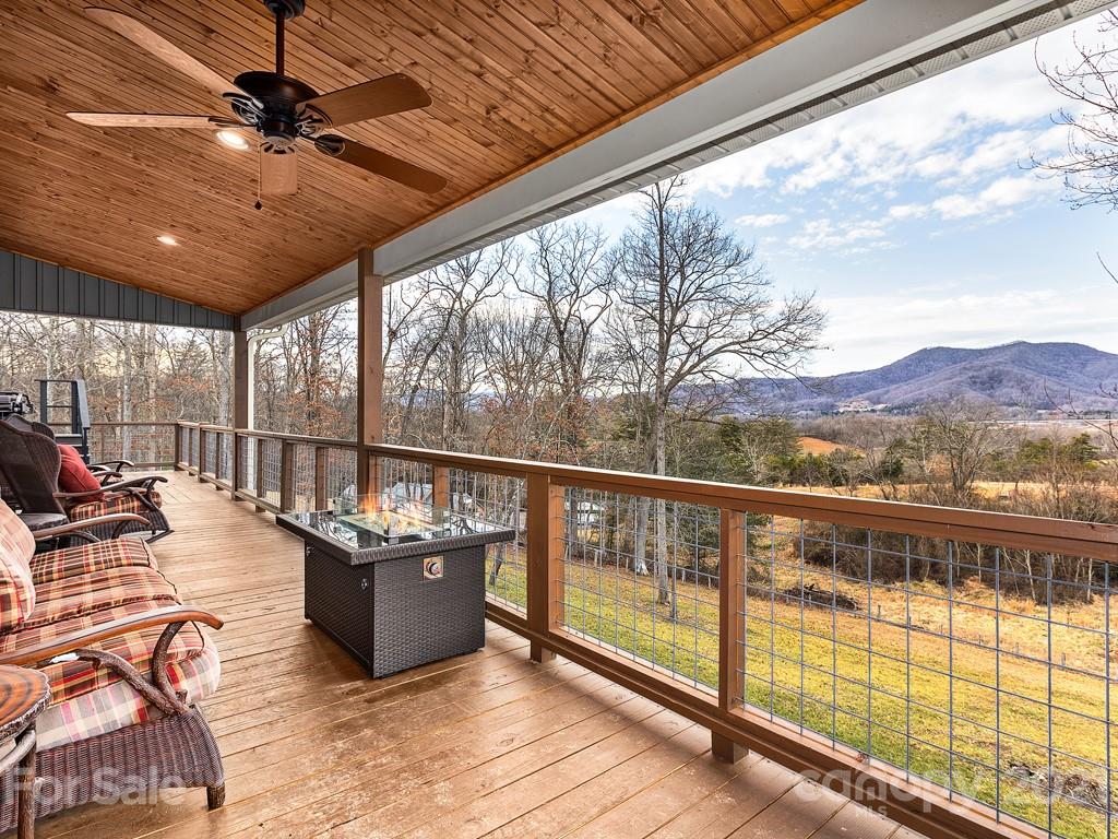 85 Dry Ridge Canton, NC 28716 - Photo 15 of 18 a view of a balcony with chairs and wooden floor