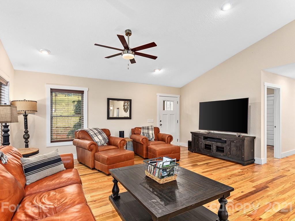 85 Dry Ridge Canton, NC 28716 - Photo 4 of 18 a living room with furniture a flat screen tv and wooden floor