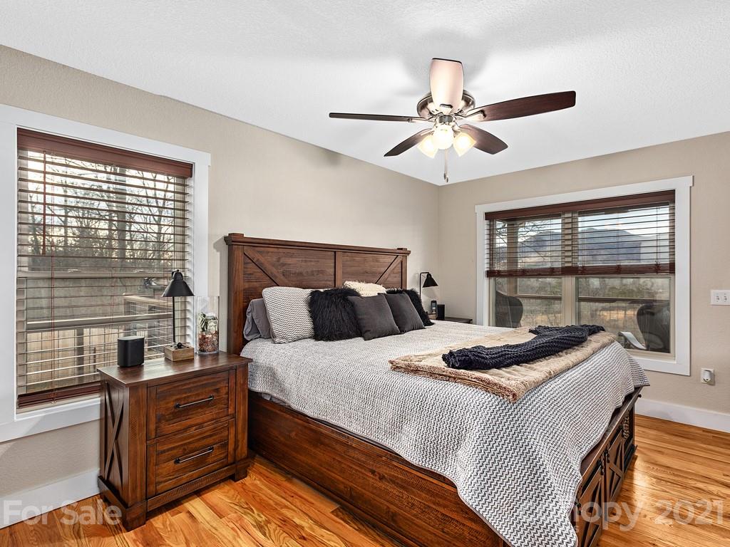 85 Dry Ridge Canton, NC 28716 - Photo 7 of 18 a bedroom with a bed and a chandelier