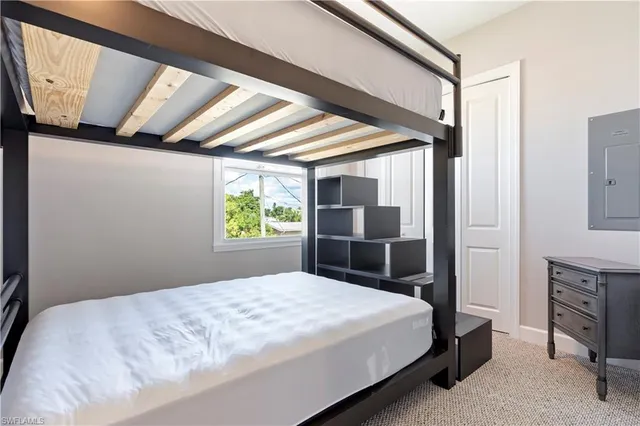 a bathroom with a granite countertop sink a toilet and shower