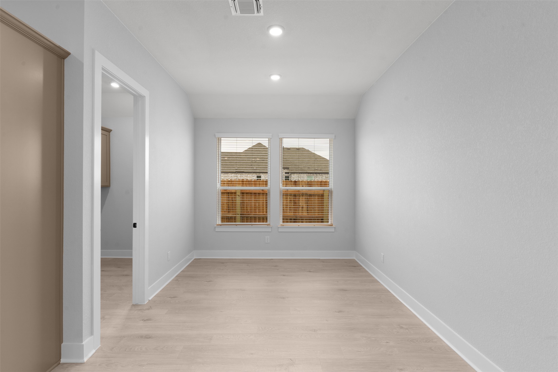 2212 Tobiano Trace Georgetown, TX 78633 - Photo 12 of 26 an empty room with a empty space and windows