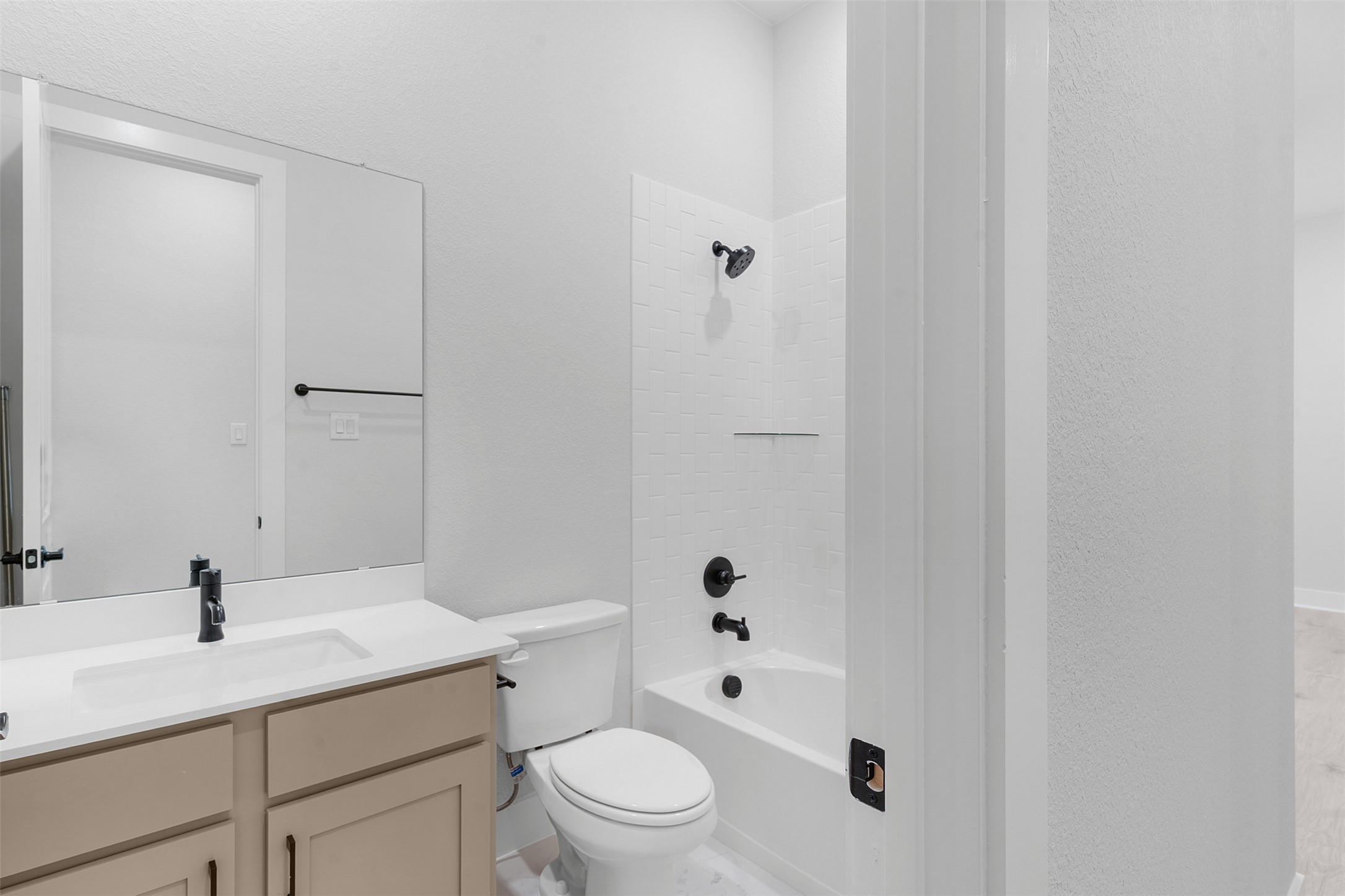 2212 Tobiano Trace Georgetown, TX 78633 - Photo 22 of 26 a bathroom with a sink a toilet and shower