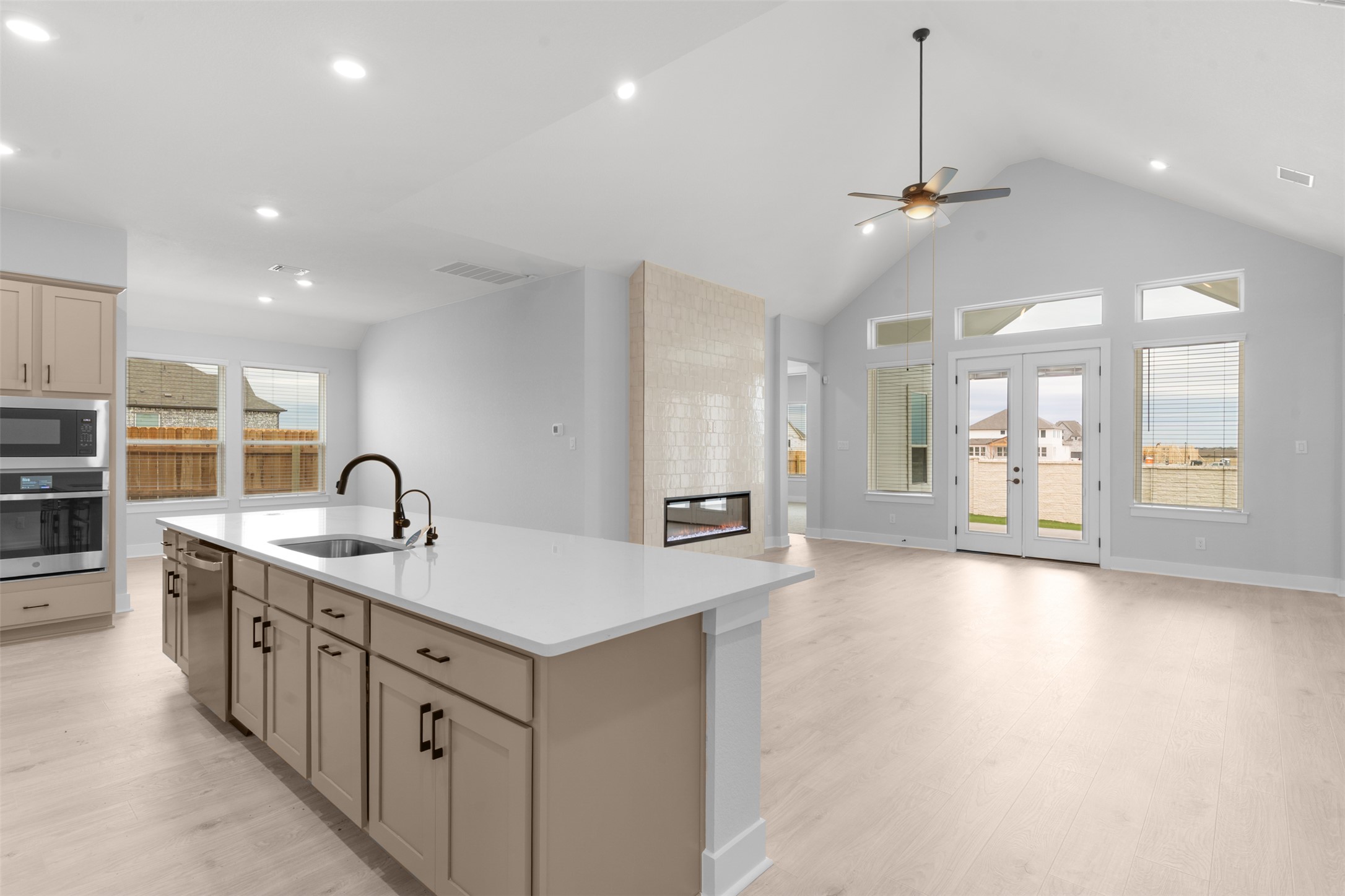 2212 Tobiano Trace Georgetown, TX 78633 - Photo 8 of 26 a kitchen with stainless steel appliances granite countertop a sink a stove and a wooden floors