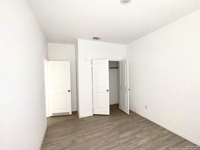 a view of a livingroom with wooden floor