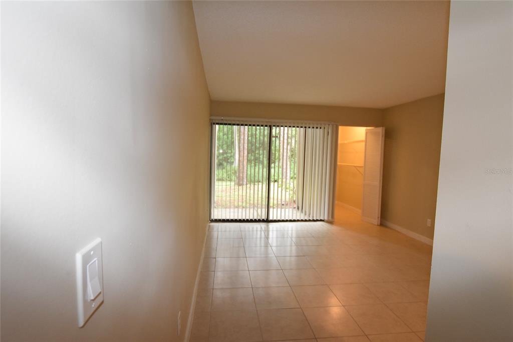 5323 Indian Creek Drive, Unit D Orlando, FL 32811 - Photo 14 of 23 a view of an empty room with a window