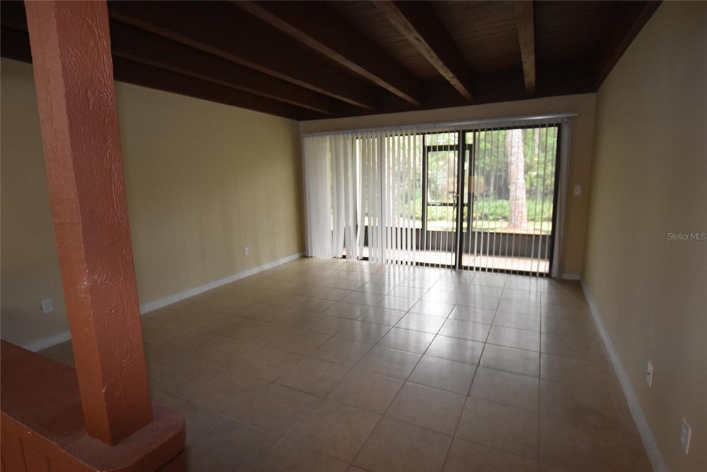 5323 Indian Creek Drive, Unit D Orlando, FL 32811 - Photo 6 of 23 a view of an empty room with a window