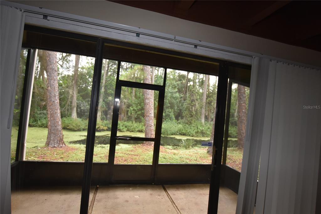 5323 Indian Creek Drive, Unit D Orlando, FL 32811 - Photo 9 of 23 a view of an empty room with large windows