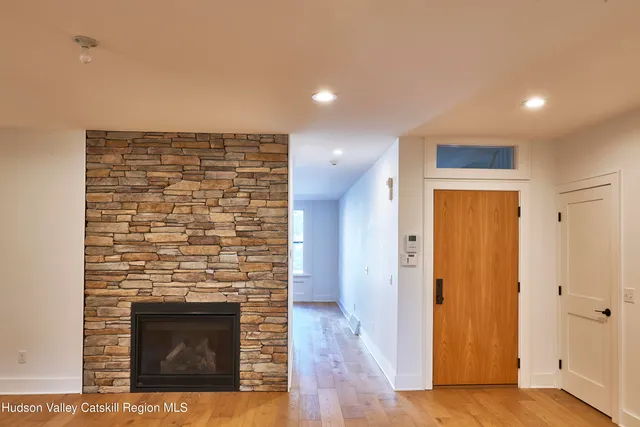 a view of an empty room and wooden floor