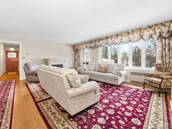 a living room with furniture and a rug